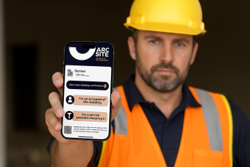Construction worker in hard hat and safety vest displaying ArcSite Australia building management software on smartphone