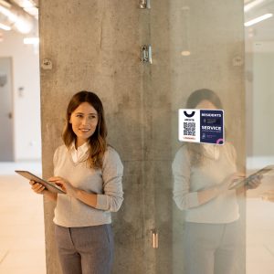 Pretty young business woman at startup office with digital tablet